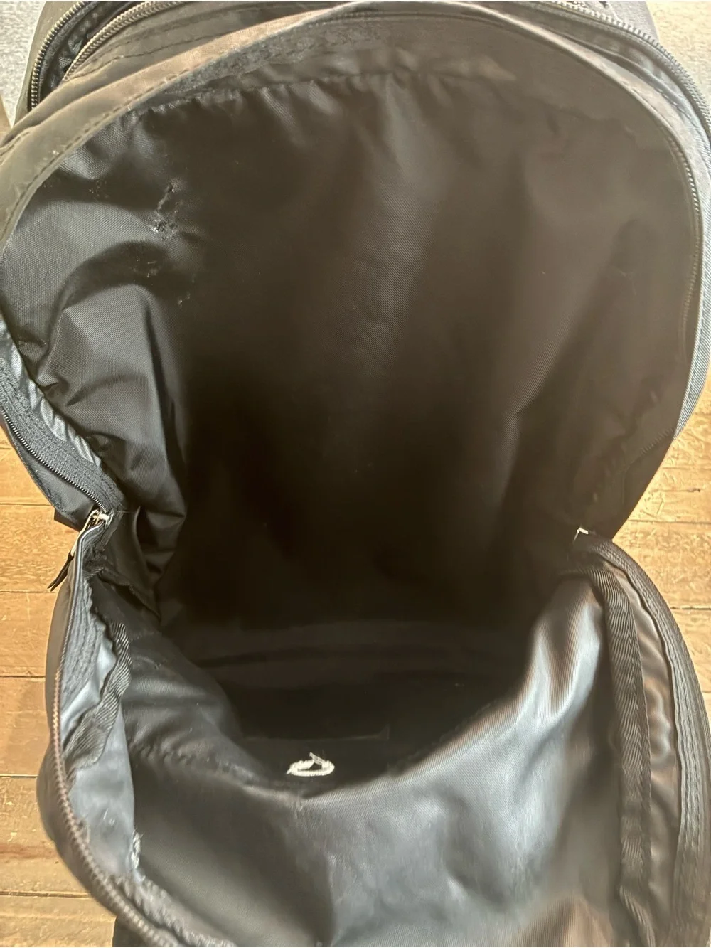 L.L. Bean Black Rolling Backpack with Silver Reflective Accent